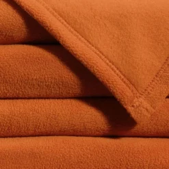 Couverture POLAIRE UNIE microfibre tempérée orange cuivré