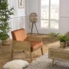 Fauteuil velours orange pieds bois et accoudoirs rotin